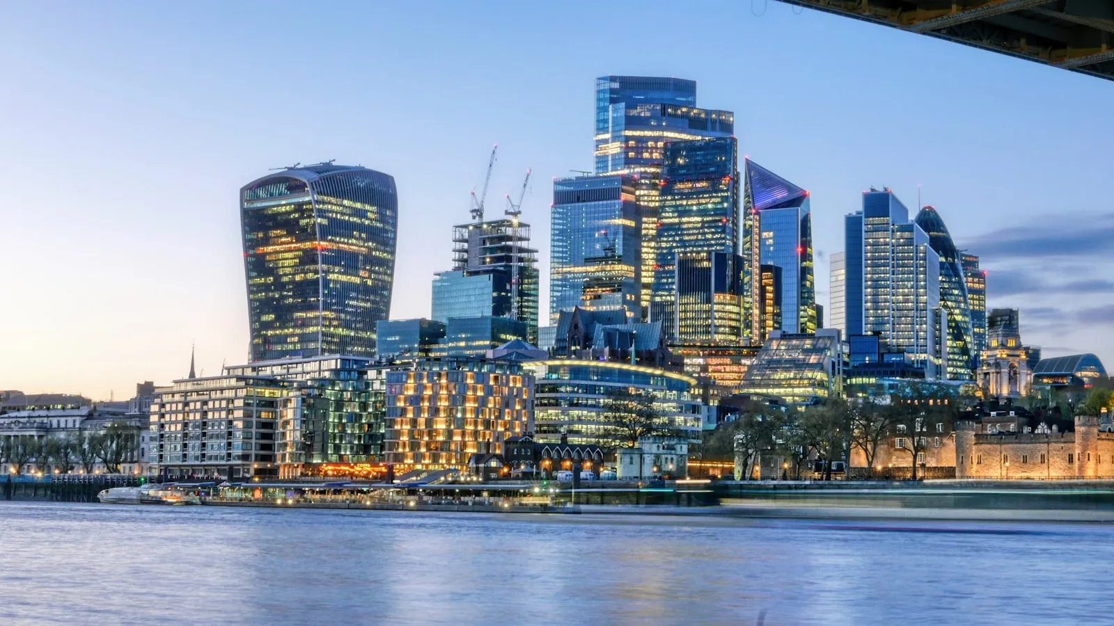 The London skyline across the Thames at dusk